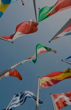 "Flags representing multiple countries flying"
