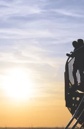 Couple Watching a Sunset From Stairs