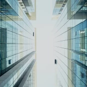 Sliver of sky between two glass buildings