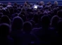 Silhouette of an audience at a conference
