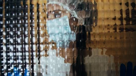 Abstract image of a medical professional in a surgical mask