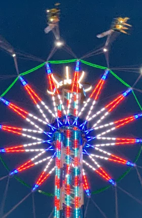 Swing amusement ride in motion