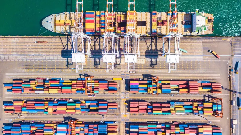 Aerial view of colorful shipping containers on a dock