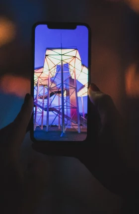 Close-up of a smartphone taking a photo of a building