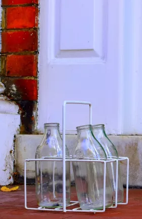 Empty milk bottles on doorstep