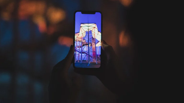 Close-up of a smartphone taking a photo of a building