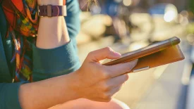 Close-up of a person scrolling through their phone