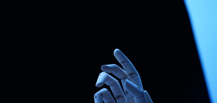 CLOSE-UP OF HUMAN HAND AGAINST BLACK BACKGROUND