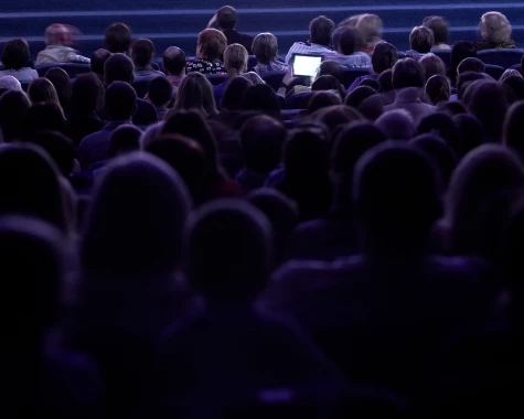 Silhouette of an audience at a conference