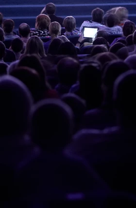 Silhouette of an audience at a conference