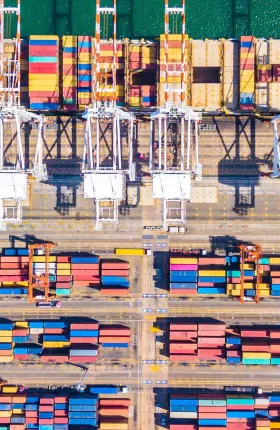 Aerial view of colorful shipping containers on a dock