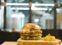 Close-up of a chicken sandwich and French fries on a plate