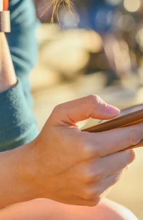 Close-up of a person scrolling through their phone