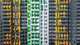 Exterior shots of modern yellow-and-black apartment buildings