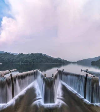 Panoramic shot of dam on water against sky