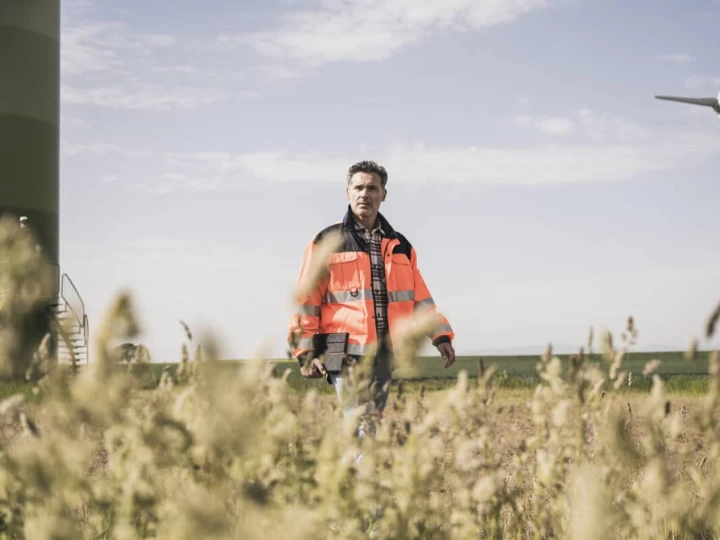 'Man in field with windmill'