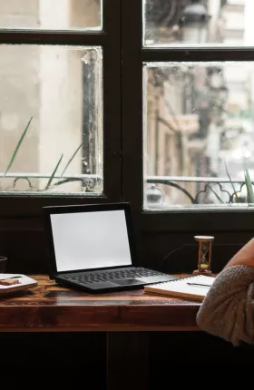 Women with headphones on sitting at desk