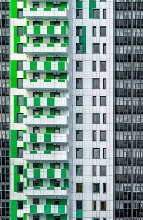 Exterior shots of modern yellow-and-black apartment buildings